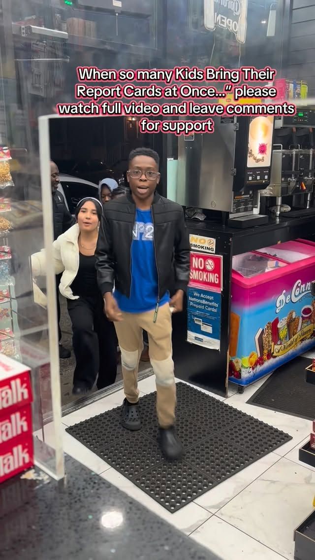 A student entering a neighborhood deli with other visitors behind them.