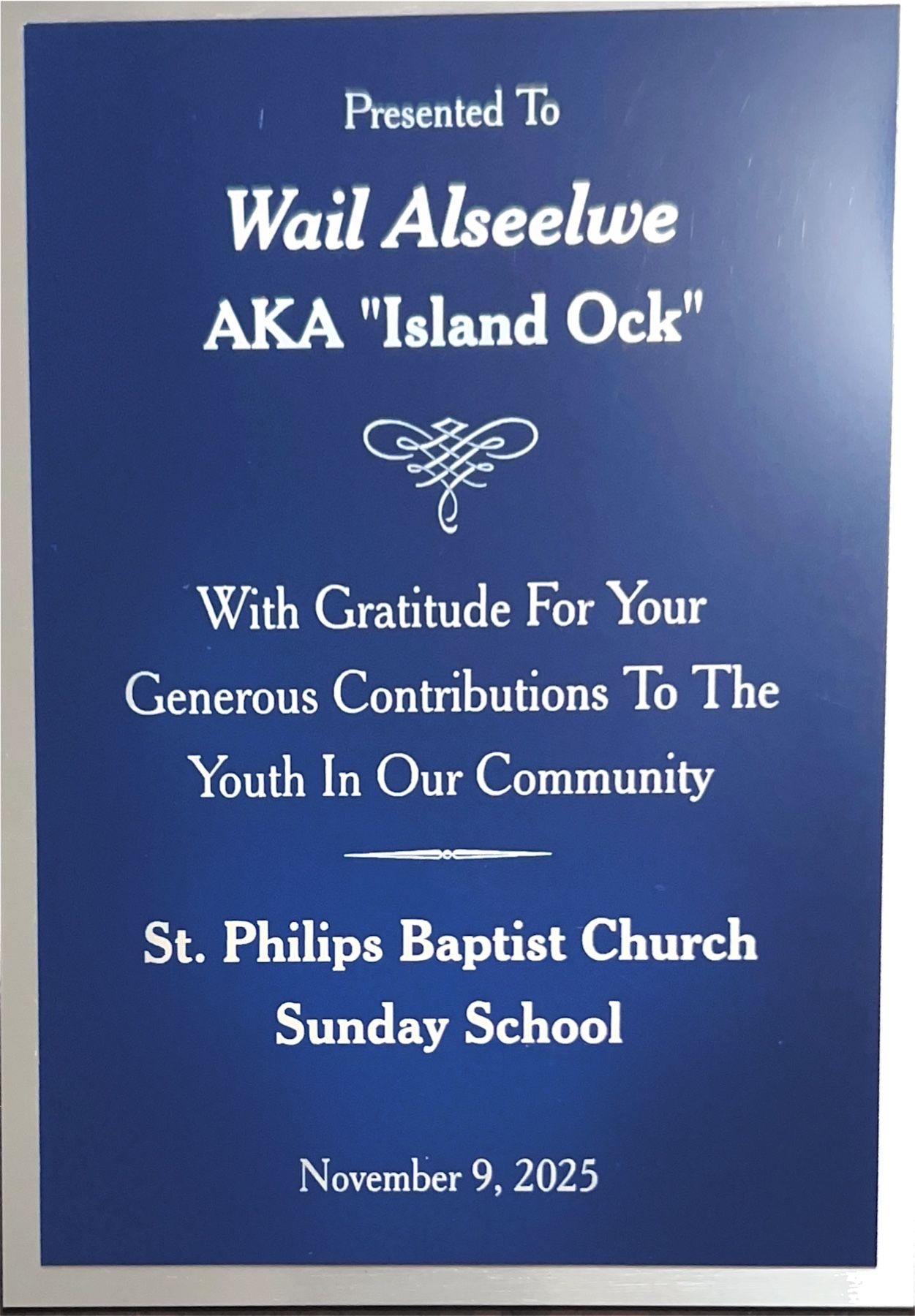 Photograph of the St. Philips Baptist Church Sunday School recognition plaque presented to Island Ock.